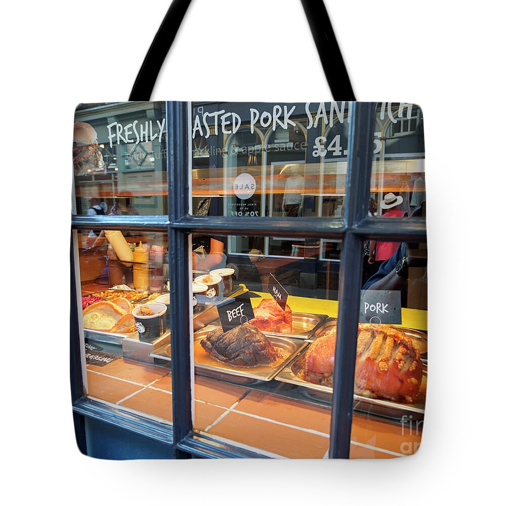 Roasted Tote Bag featuring the photograph Roasted meats in a shop window in York England by Louise Heusinkveld