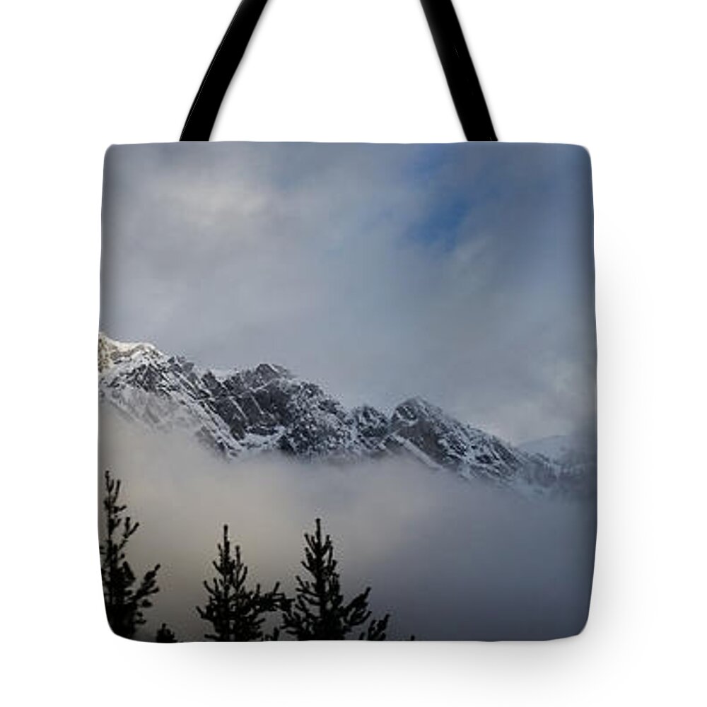 Mountains Tote Bag featuring the photograph Rockies in the Clouds. by Ellery Russell