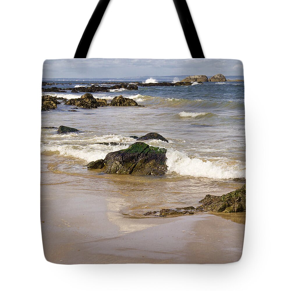 Rocks Tote Bag featuring the photograph Rocks, waves, sand and sky reflection. by Elena Perelman