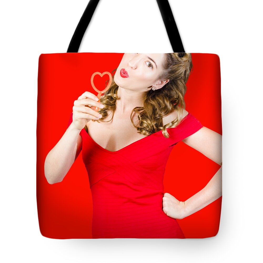 Valentines Day Tote Bag featuring the photograph Romantic blond pin-up lady blowing party bubbles by Jorgo Photography