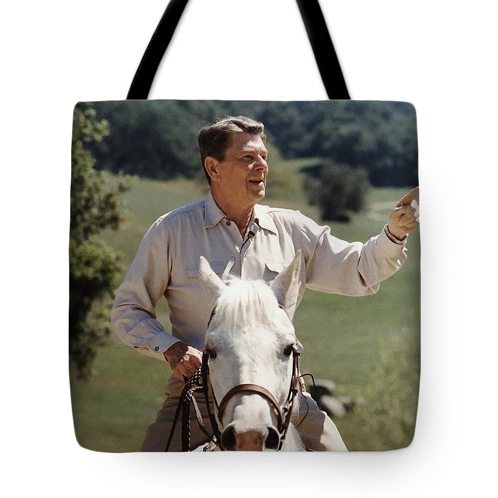Ronald Reagan Tote Bag featuring the photograph Ronald Reagan On Horseback by War Is Hell Store