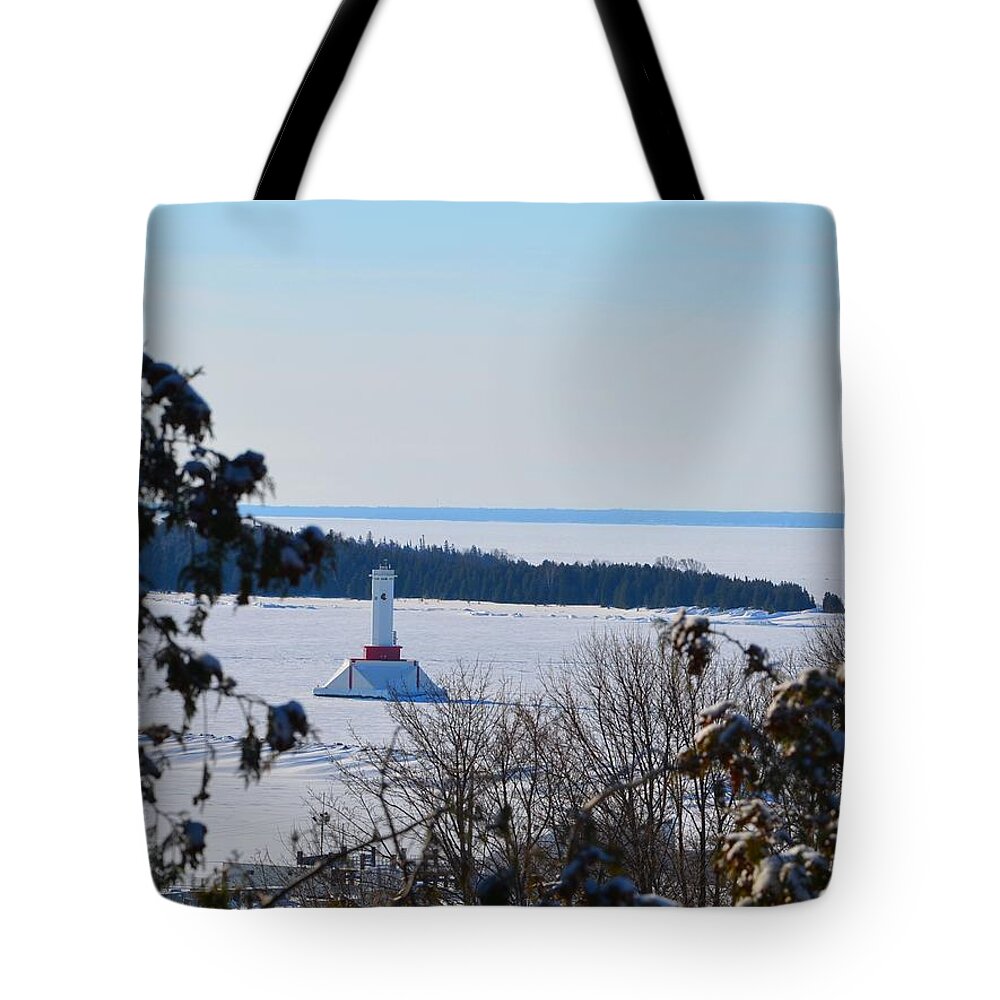 Lighthouse Tote Bag featuring the photograph Round Island Passage Light Through The Trees by Keith Stokes