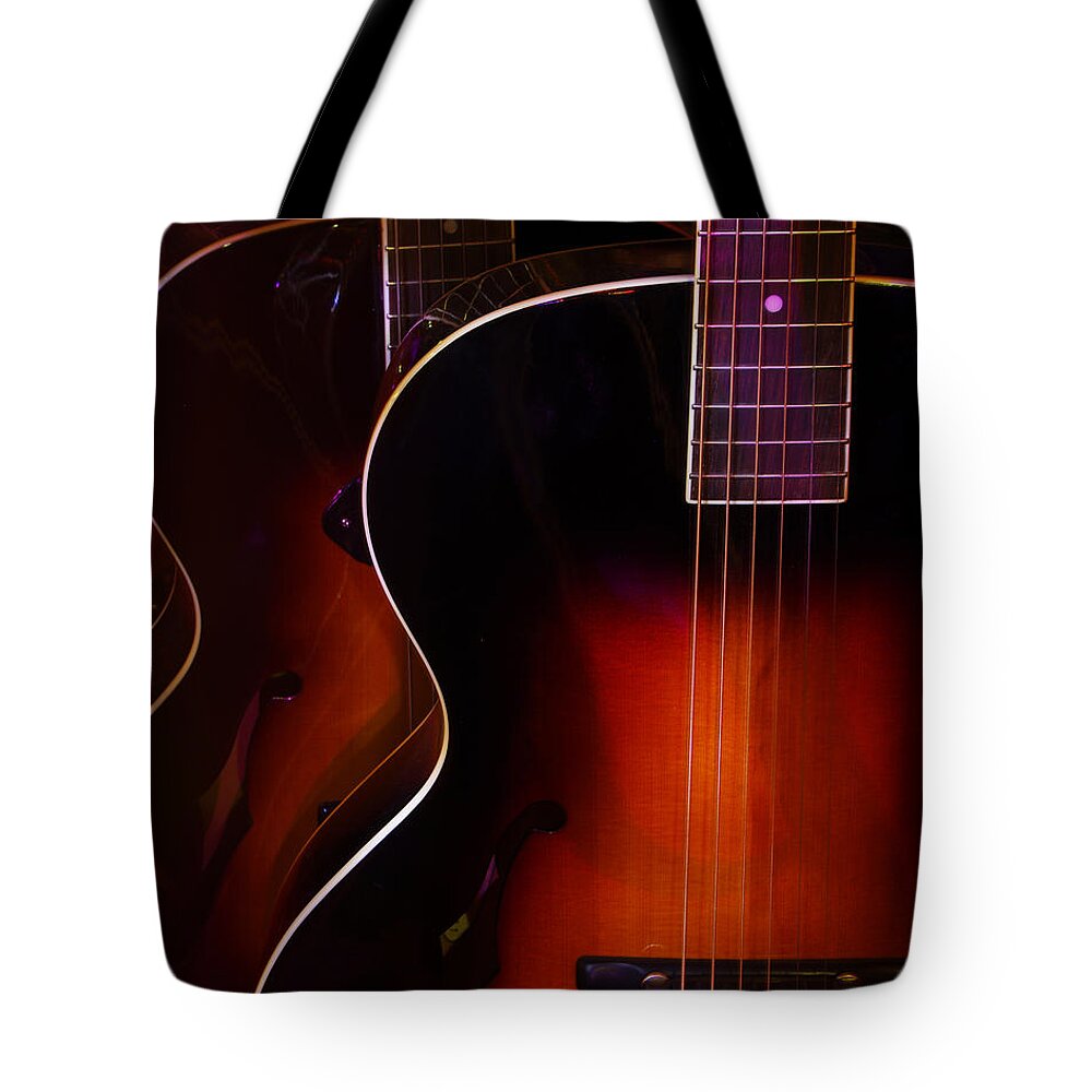 Guitars Tote Bag featuring the photograph Row of guitars by Jim Mathis
