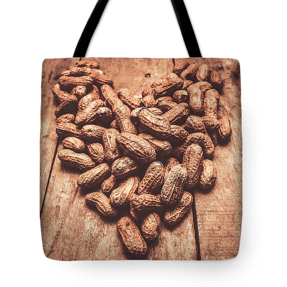 Peanut Tote Bag featuring the photograph Rustic country peanut heart. Natural foods by Jorgo Photography