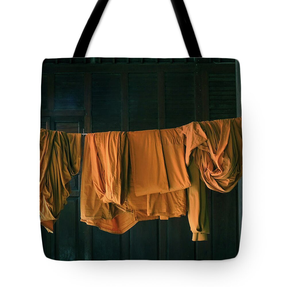 Buddhism Tote Bag featuring the photograph Saffron robes by Jeremy Holton