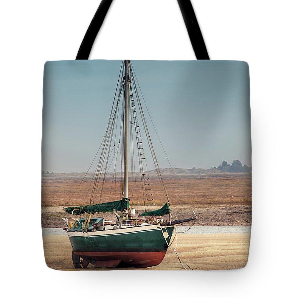 Wells Tote Bag featuring the photograph Norfolk sail boat stranded at low tide by Simon Bratt