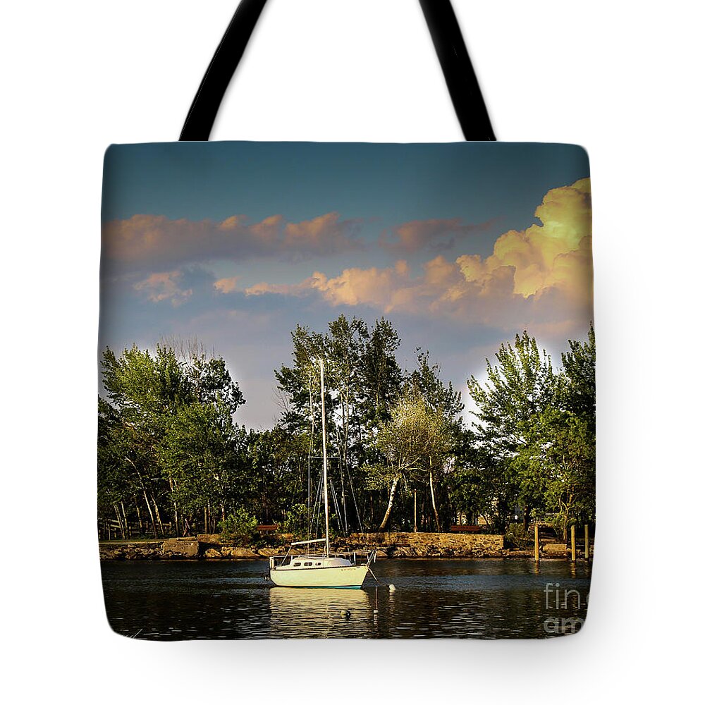 Boat Tote Bag featuring the photograph Sailboat in the bay by Les Greenwood