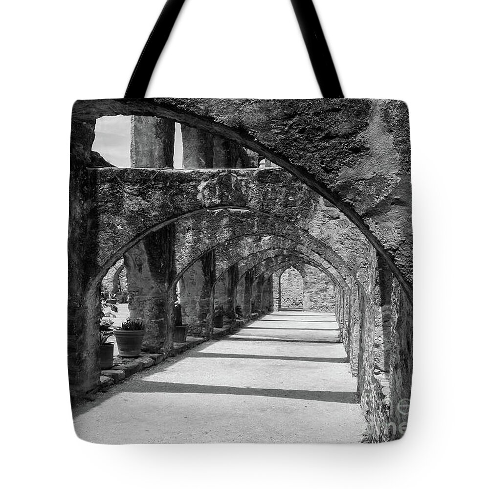 San Antonio Tote Bag featuring the photograph San Antonio Mission arches in black and white by Paul Quinn