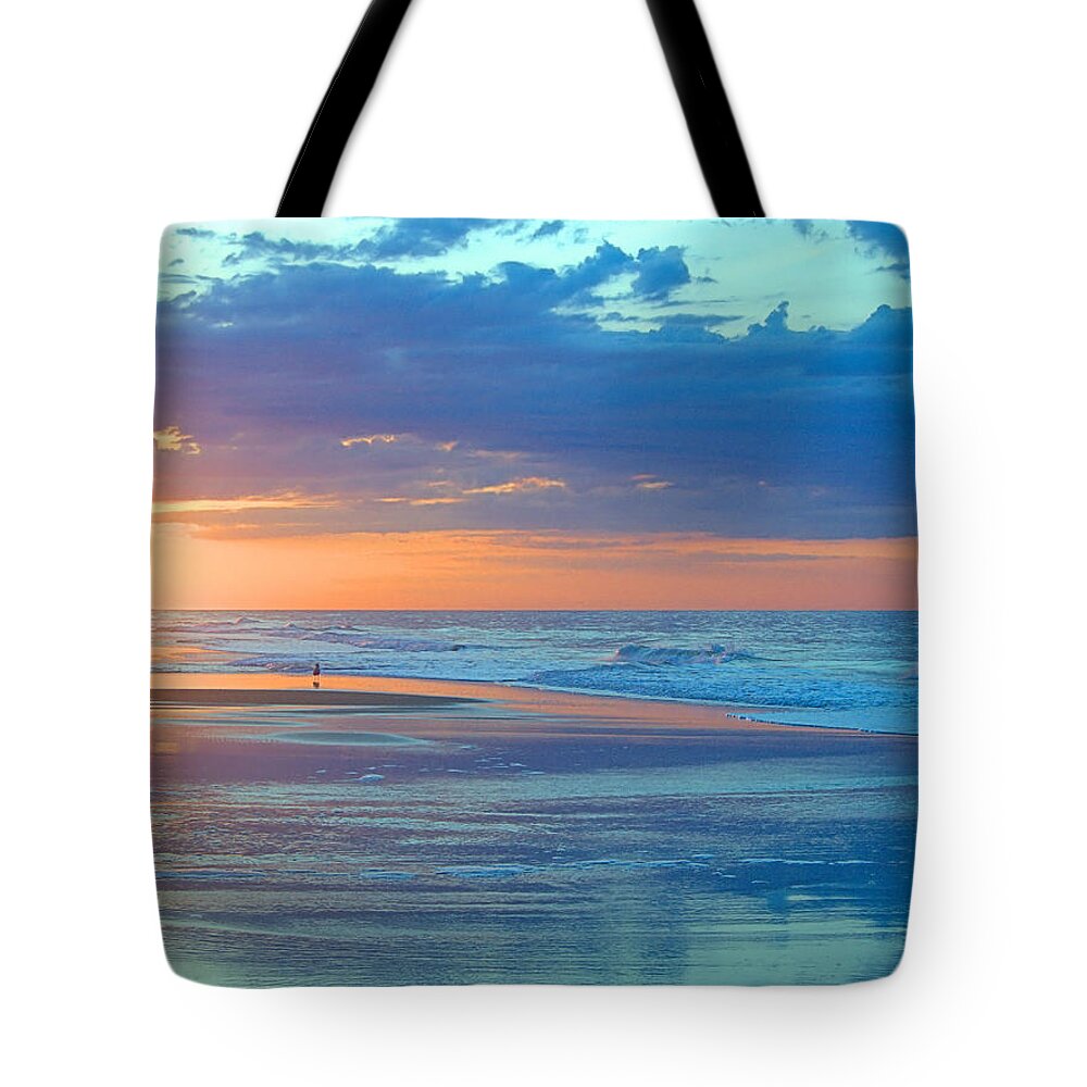 Serenity Tote Bag featuring the photograph Serenity by Newwwman