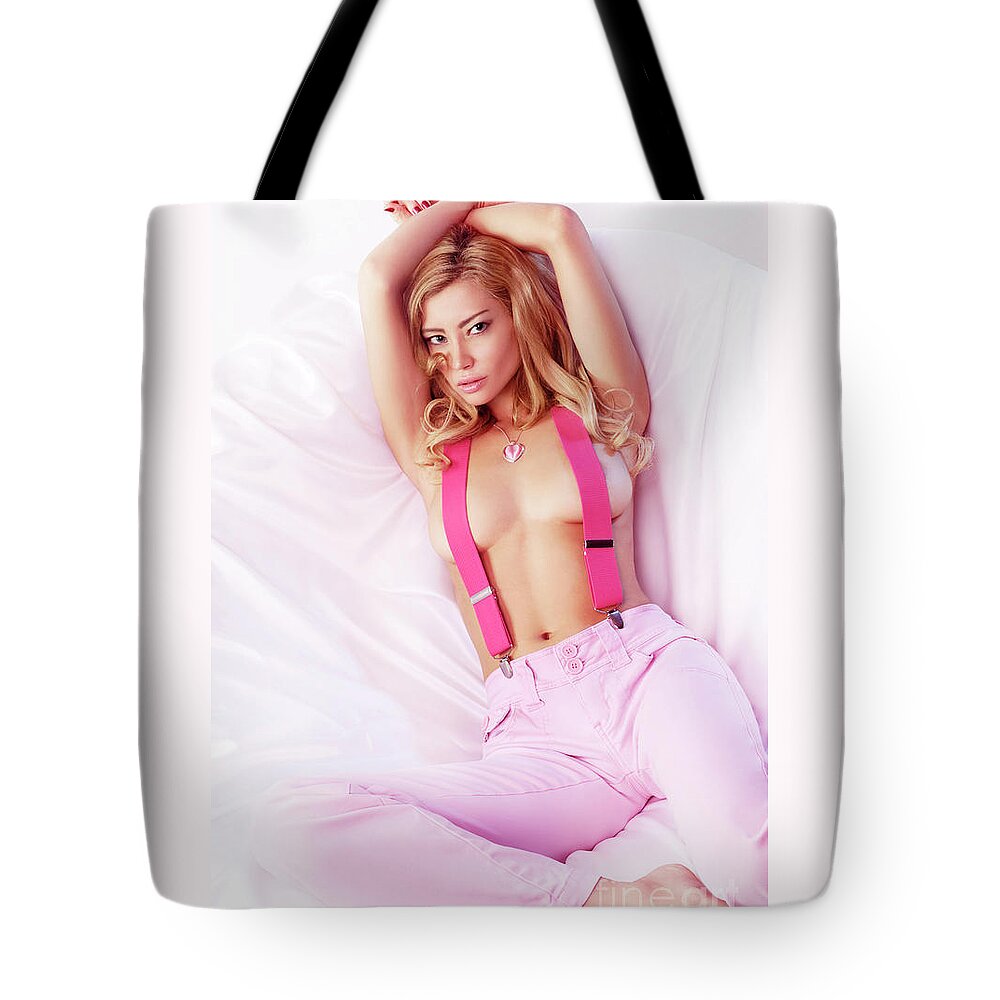 Glamour Tote Bag featuring the photograph Sexy Young Topless Blond Woman in Pink Jeans with Suspenders by Maxim Images Exquisite Prints