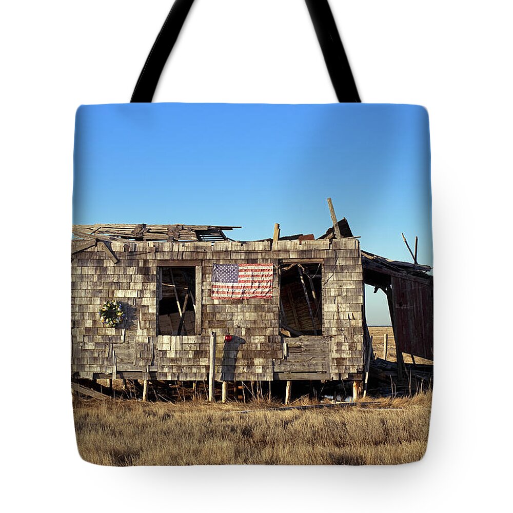 Abandoned Tote Bag featuring the photograph Shack with American flag by John Greim