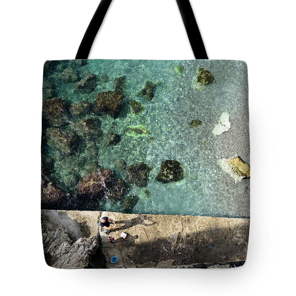 Shadow Tote Bag featuring the photograph Shadow of the Fisherman by Bob VonDrachek