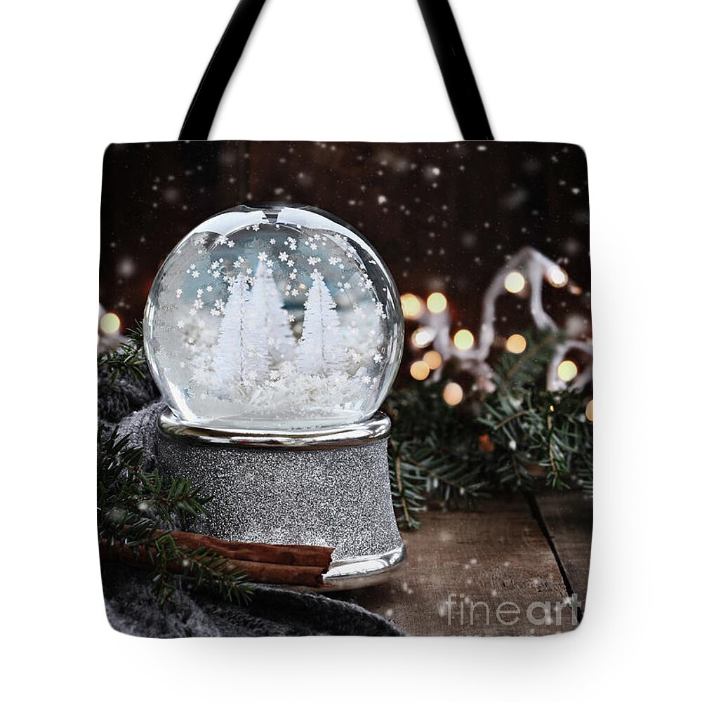 Snowglobe Tote Bag featuring the photograph Silver Snow Globe by Stephanie Frey