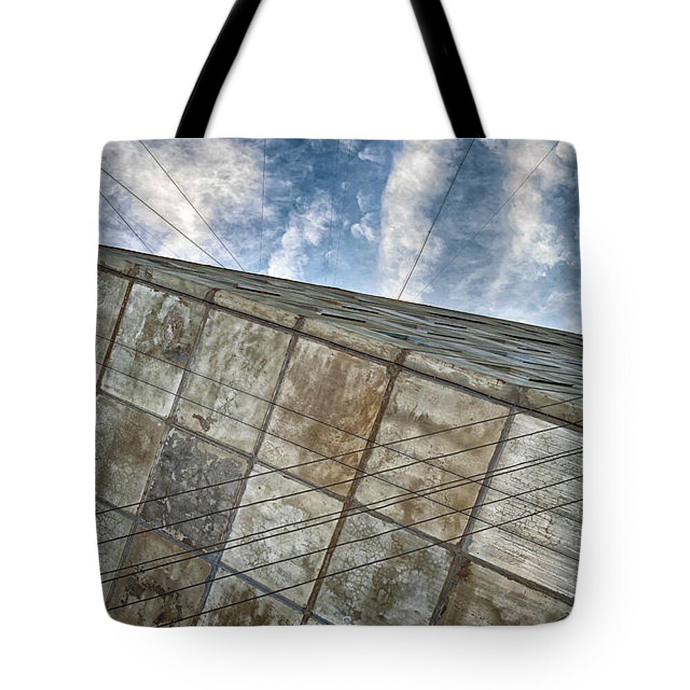 Architecture Tote Bag featuring the photograph Sinking Building Sky of Dread by John Williams