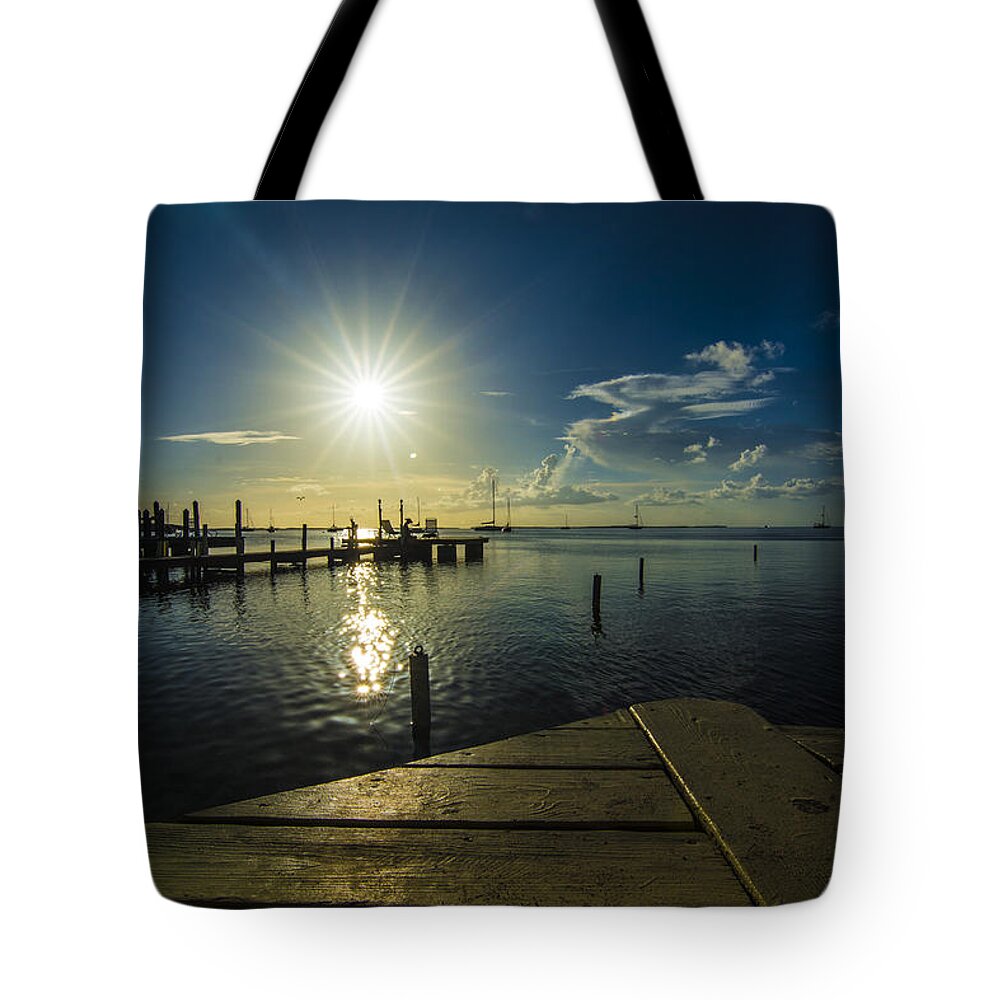 Sunset Tote Bag featuring the photograph Sitting On The Dock Of The Bay by Kevin Cable