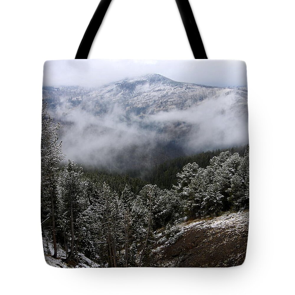 Yellowstone National Park Tote Bag featuring the photograph Snow and Clouds in the Mountains by Larry Ricker