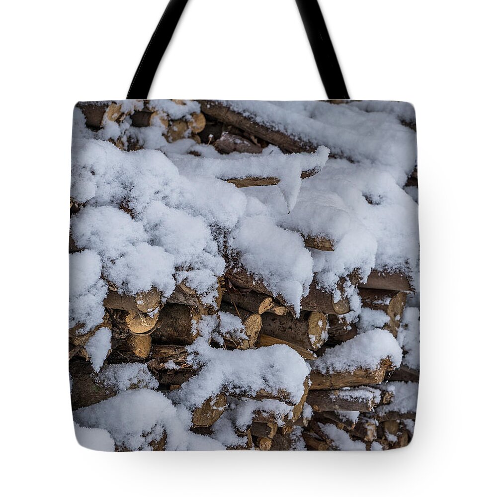 Landscape Tote Bag featuring the photograph Snow Covered Firewood by Chris Bordeleau