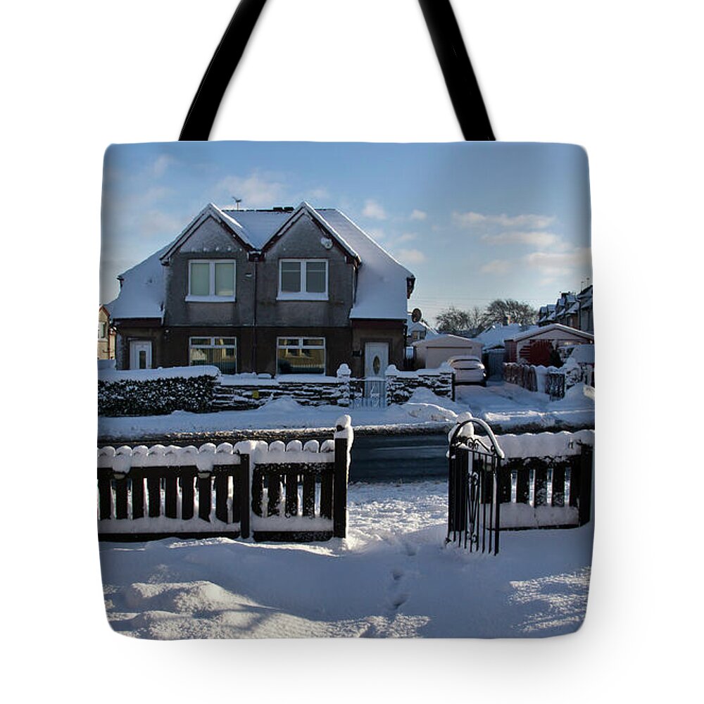 Village Tote Bag featuring the photograph Snow in a village by Elena Perelman