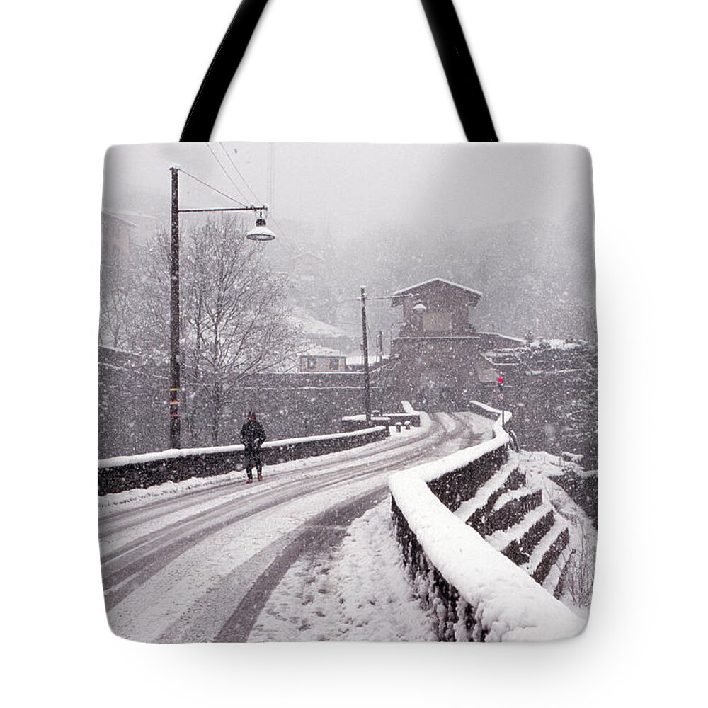 Snow Tote Bag featuring the photograph Snow on the road to Bergamo by Riccardo Mottola