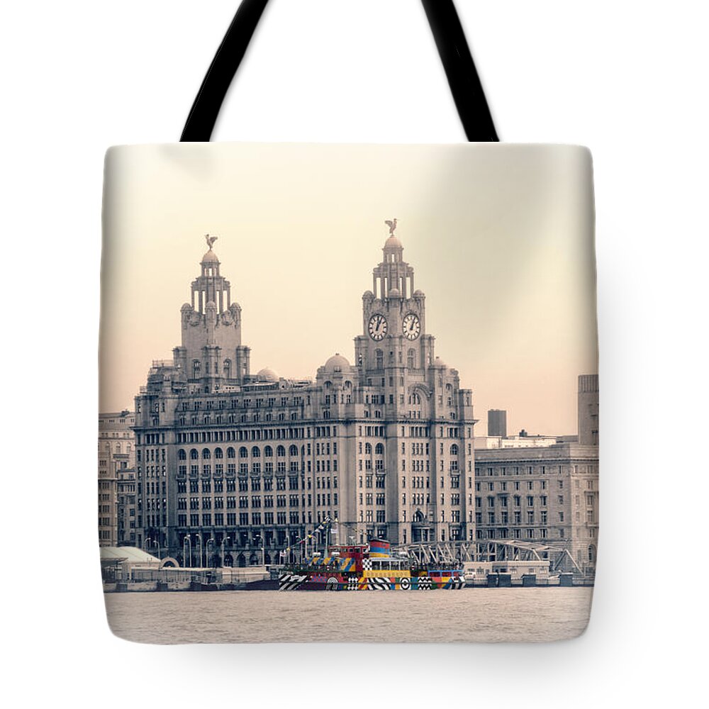 Pier Tote Bag featuring the photograph Snowdrop Dazzles in front of the Liverbirds by Spikey Mouse Photography