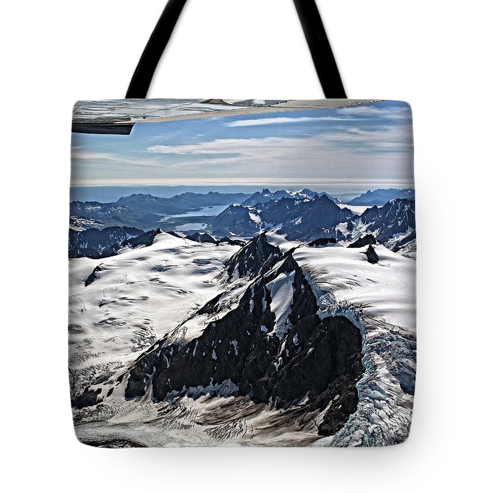 Alaska Tote Bag featuring the photograph Somewhere over Alaska by Waterdancer 