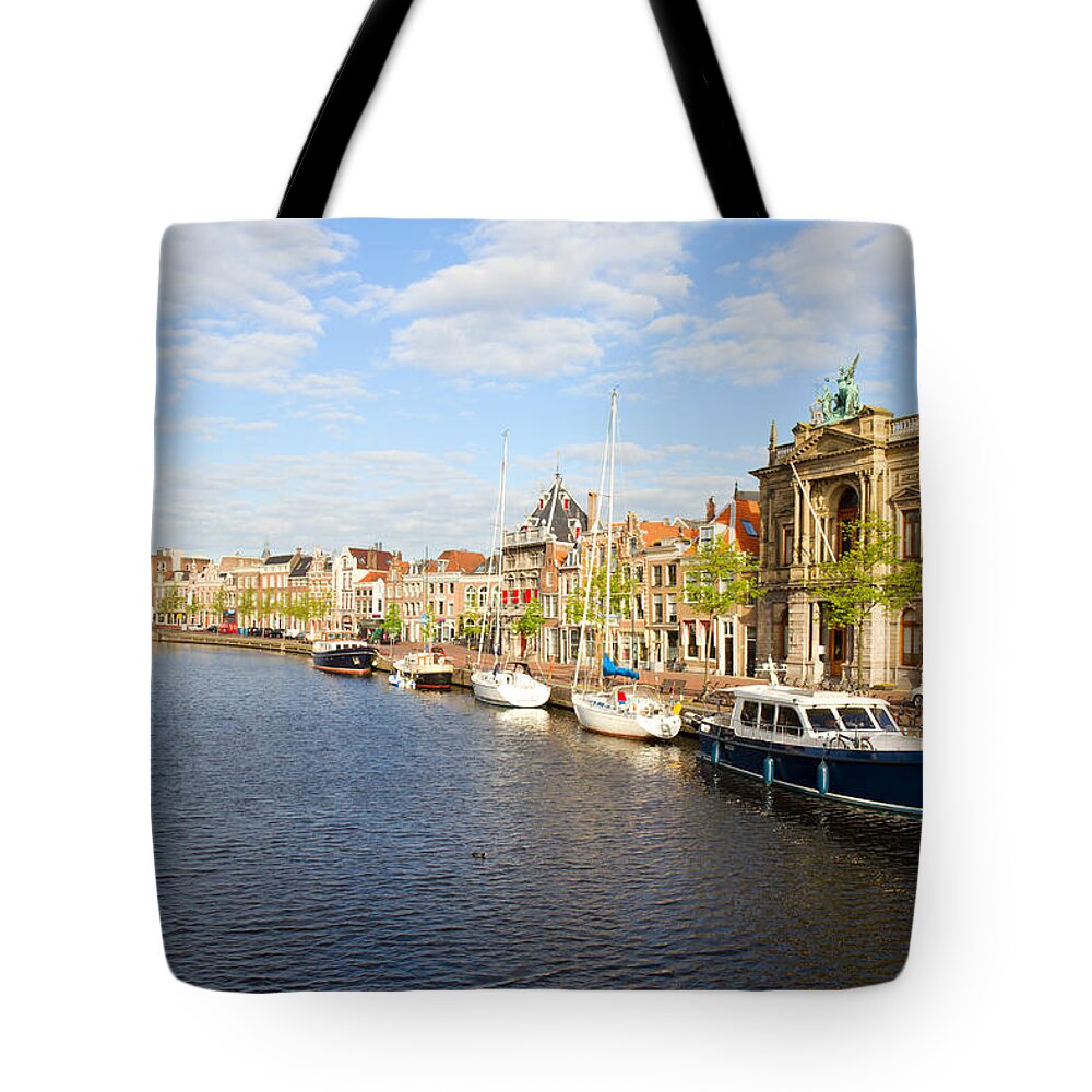 Haarlem Tote Bag featuring the photograph Spaarne and Haarlem by Anastasy Yarmolovich