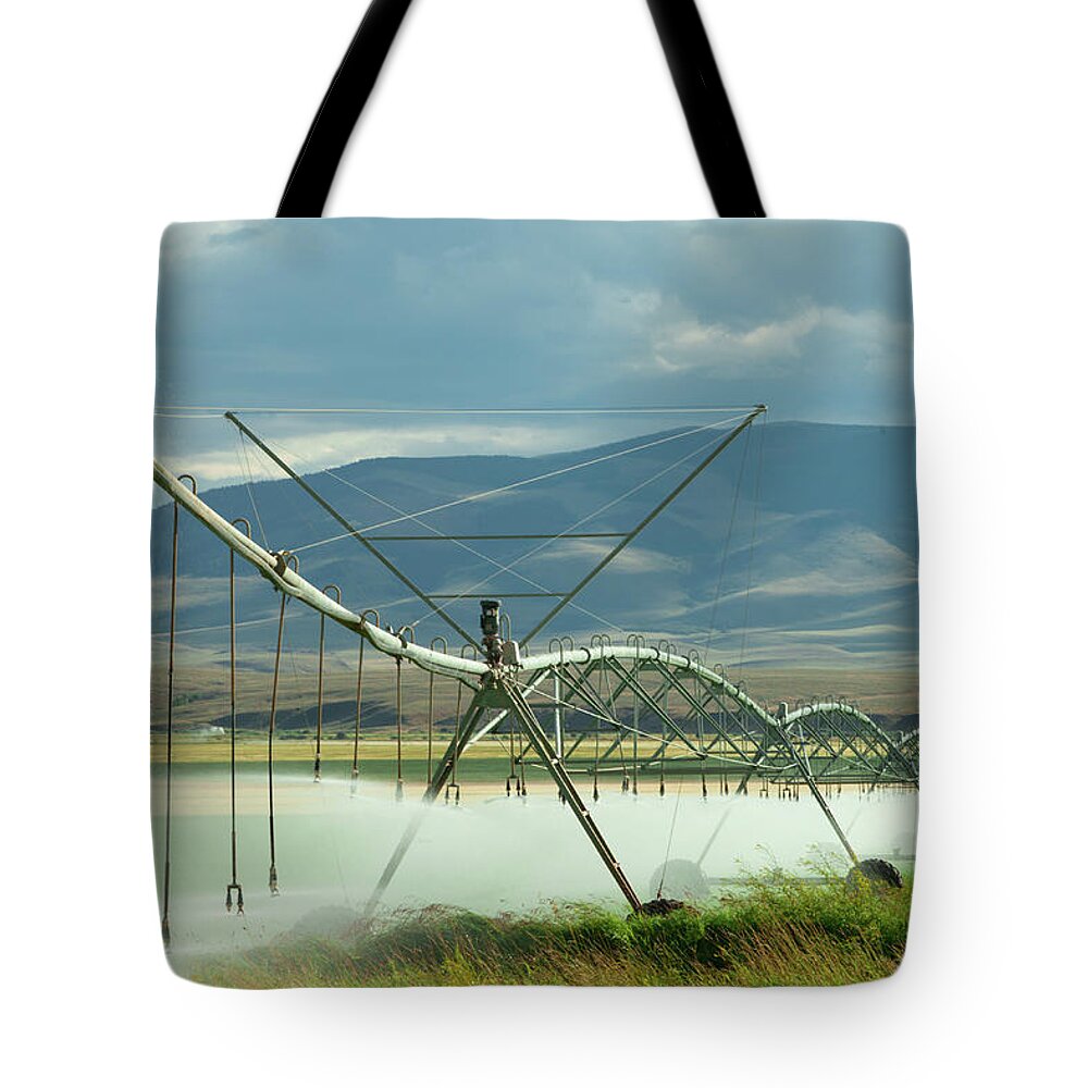 Irrigation Tote Bag featuring the photograph Spraying Water by Todd Klassy