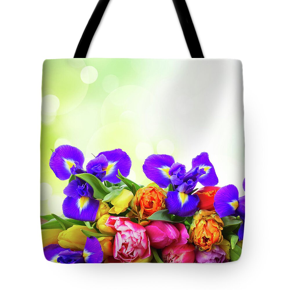 Easter Tote Bag featuring the photograph Spring Tulips and Irises by Anastasy Yarmolovich