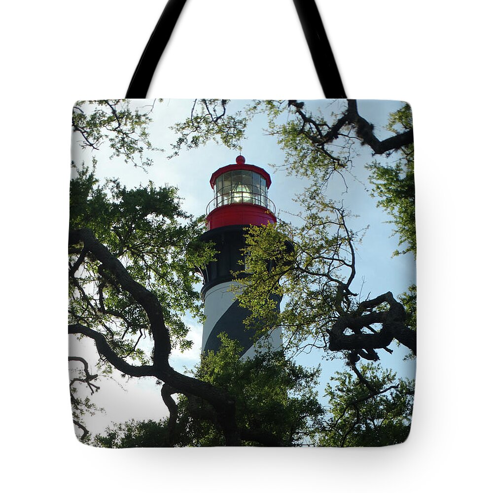 St. Augustine Light Station Tote Bag featuring the photograph St. Augustine Light Through the Trees by David T Wilkinson