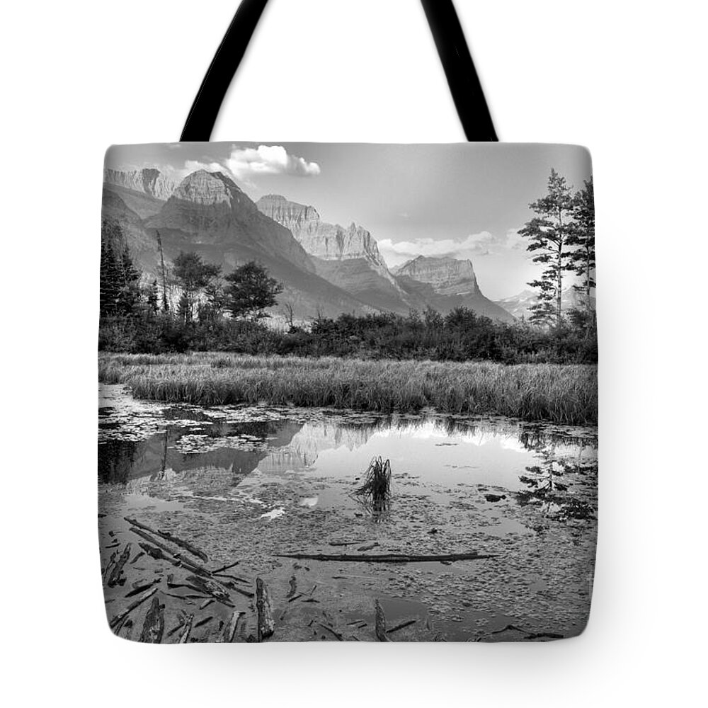 St Mary Lake Tote Bag featuring the photograph St Mary Peaks Hazy Reflections Black And White by Adam Jewell