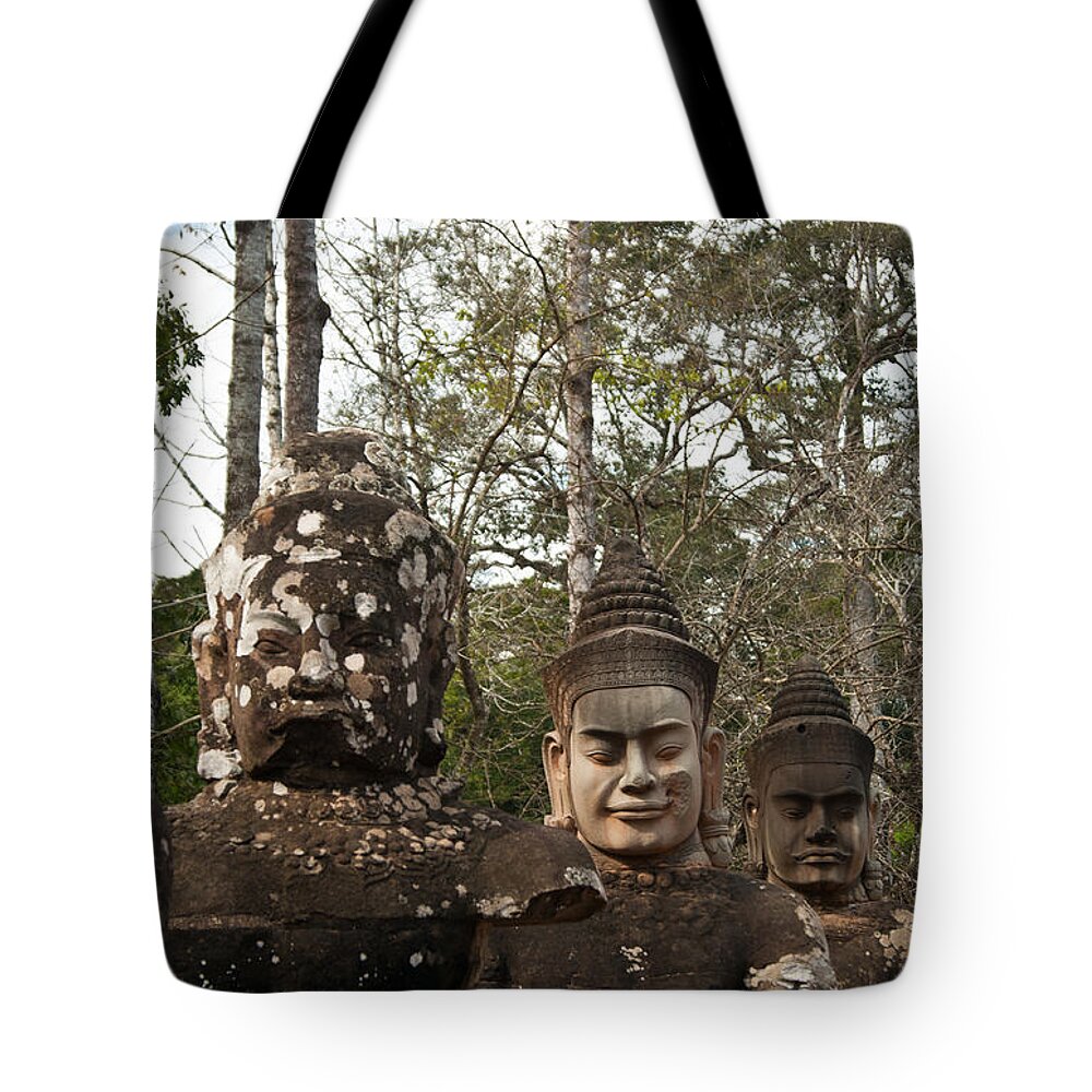  Tote Bag featuring the photograph Statue Heads Ankor Thom by James Gay