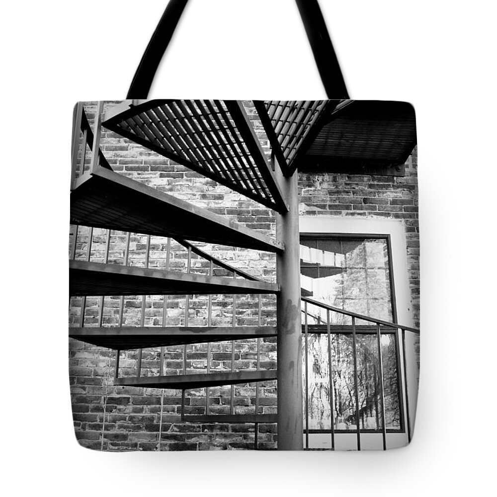 Brick Tote Bag featuring the photograph Steel Spiral by Greg Fortier
