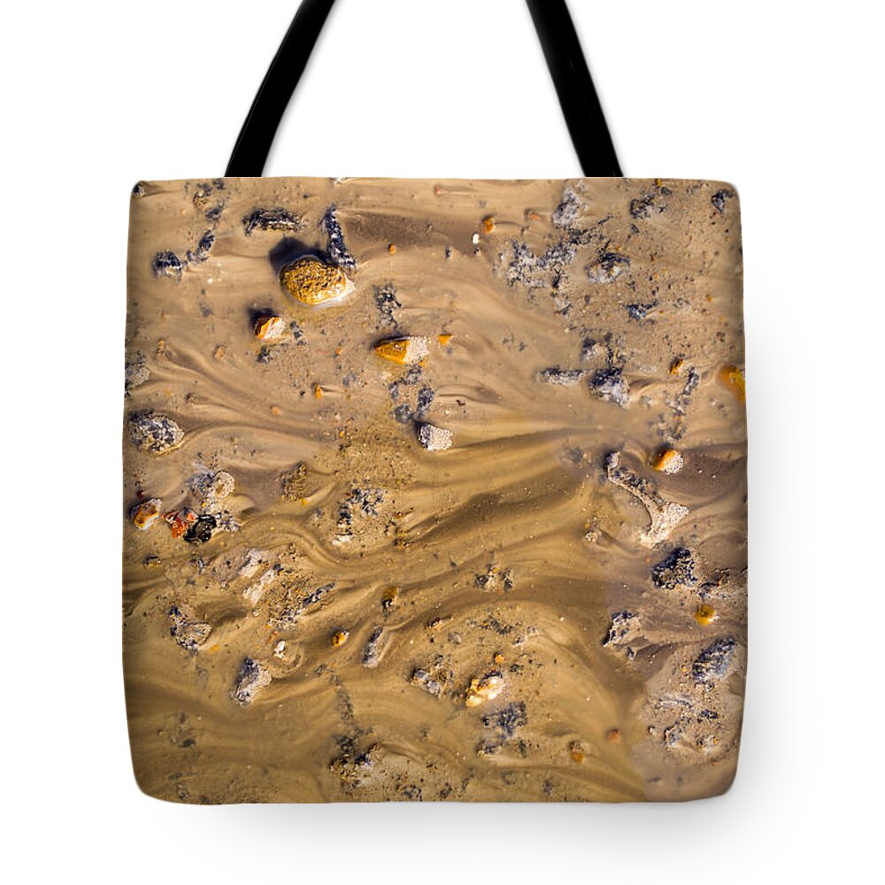 Stones In Water Tote Bag featuring the photograph Stones in a Mud Water Wash by John Williams
