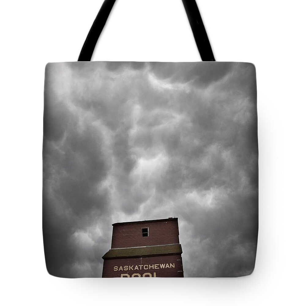 Stormy Tote Bag featuring the photograph Storm Clouds Saskatchewan Grain Elevator by Mark Duffy