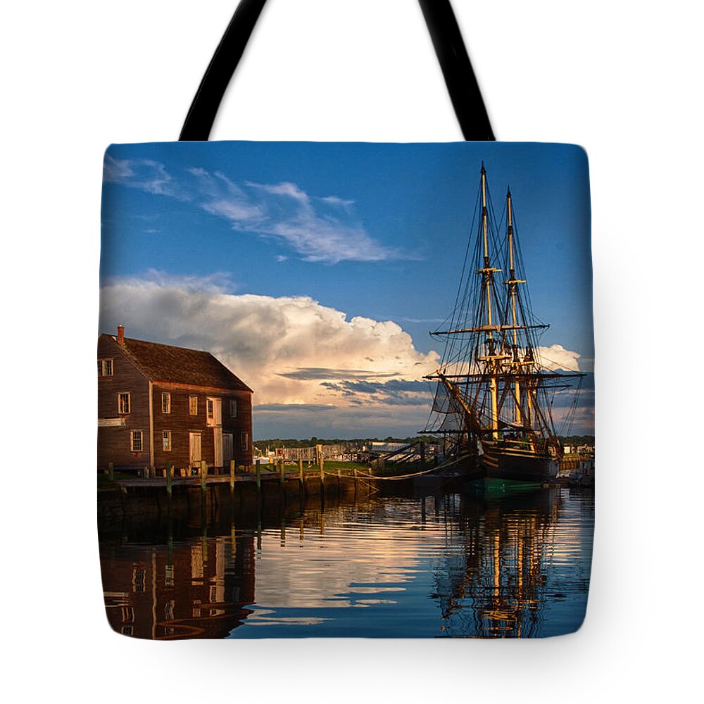 Salem Tote Bag featuring the photograph Storm leaves reflection on Salem by Jeff Folger