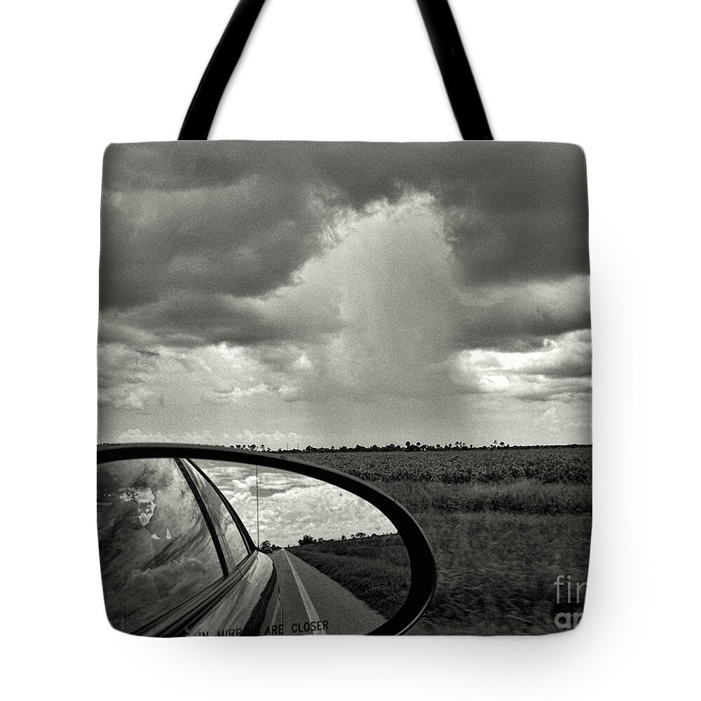 Clouds Tote Bag featuring the photograph Stormfront by Jeff Breiman