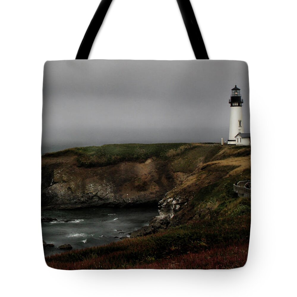Lighthouse Tote Bag featuring the photograph Storm's Brewing by Deborah Jahier