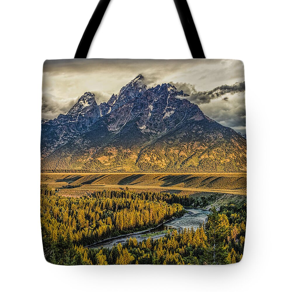 Grand Teton National Park Tote Bag featuring the photograph Stormy Sunrise over the Grand Tetons and Snake River by Josh Bryant
