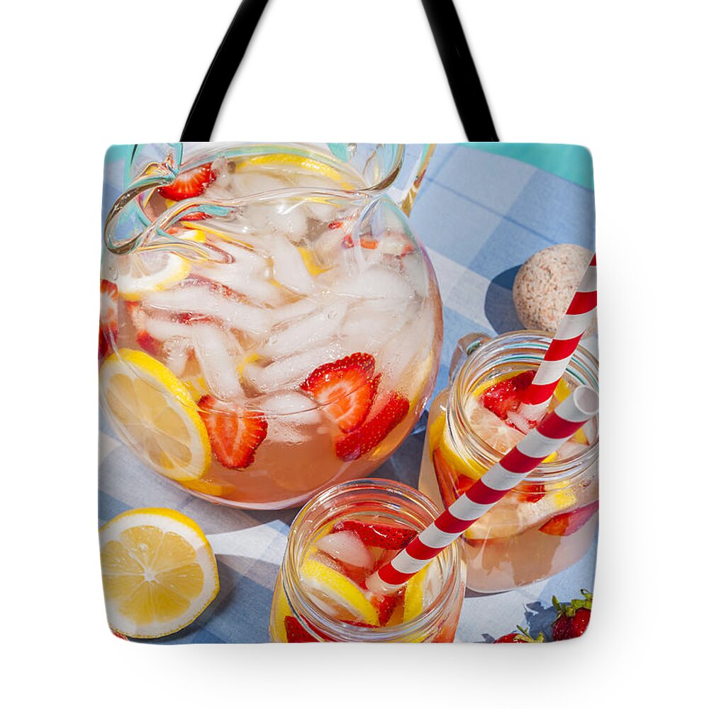 Lemonade Tote Bag featuring the photograph Strawberry lemonade at pool side 2 by Elena Elisseeva