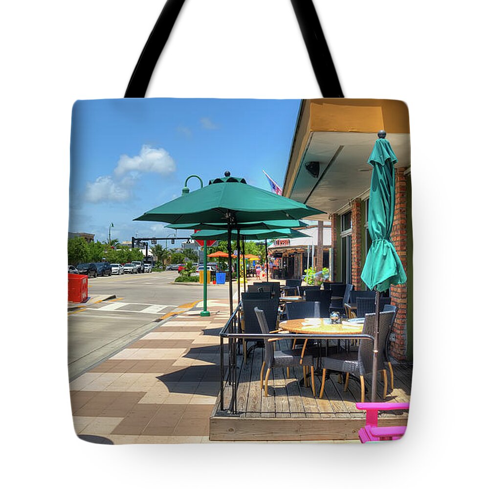 Shady Tote Bag featuring the photograph Streetside Dining by Ules Barnwell