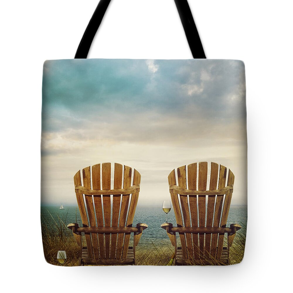 Atmosphere Tote Bag featuring the photograph Summer chairs sand dunes and ocean in background by Sandra Cunningham