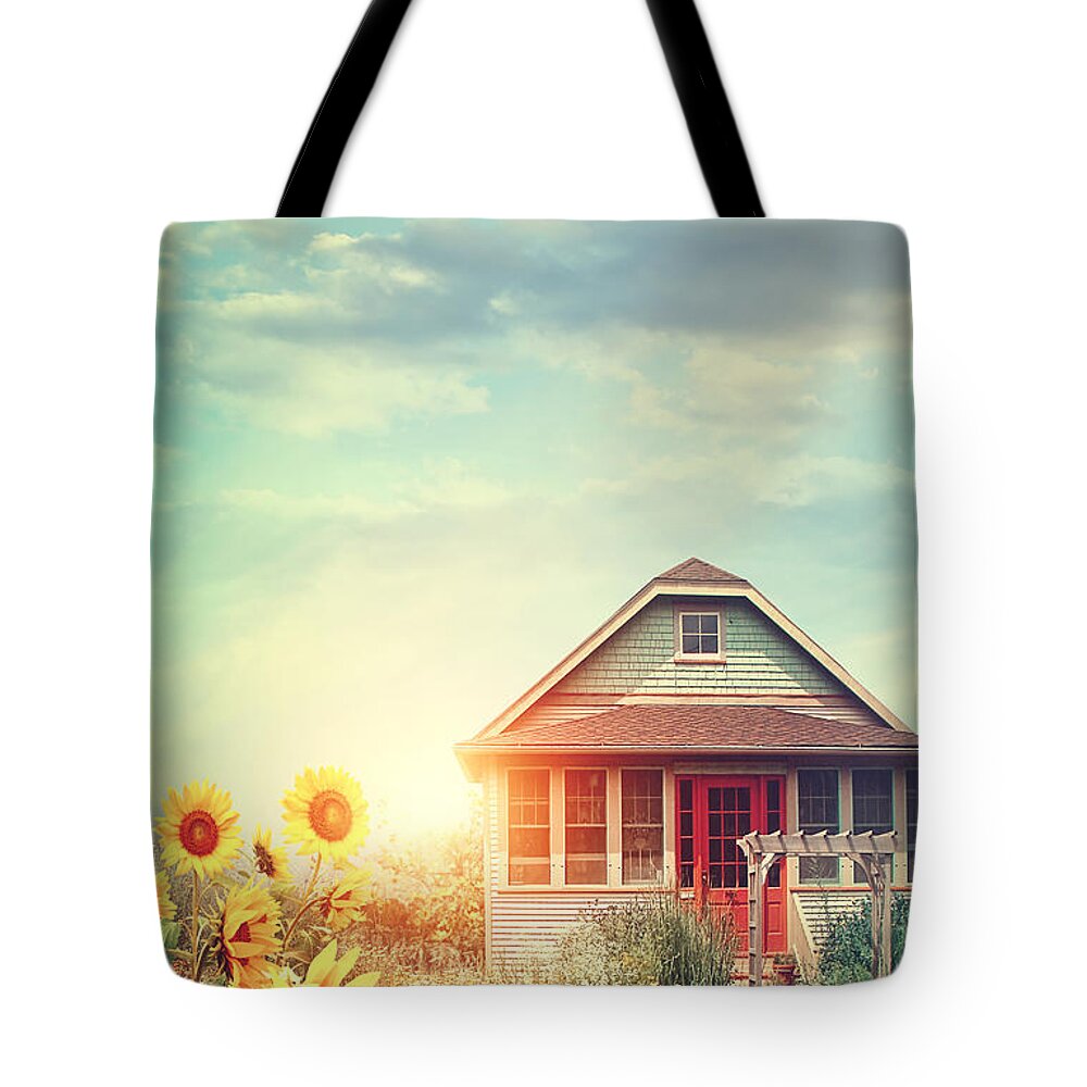 Atmosphere Tote Bag featuring the photograph Summer house with a garden full of flowers by Sandra Cunningham