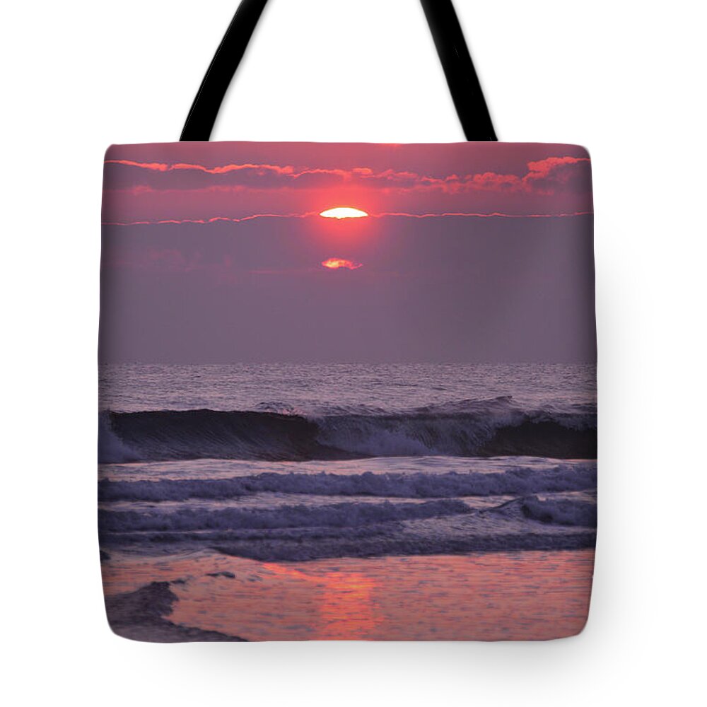 Tide Tote Bag featuring the photograph Sun rising through the violet cloud bank by Julianne Felton