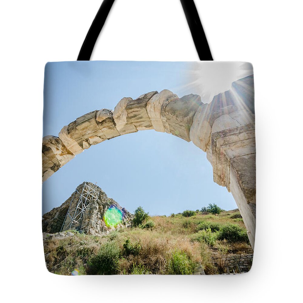 Turkey Tote Bag featuring the photograph Sun Shining on an Ephesus Arch by Anthony Doudt