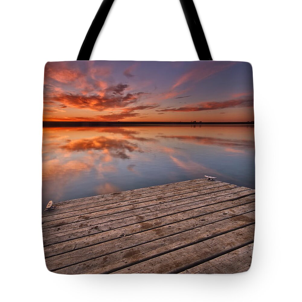 Sunrise Tote Bag featuring the photograph Sunrise over a Colorado fishing dock by Ronda Kimbrow