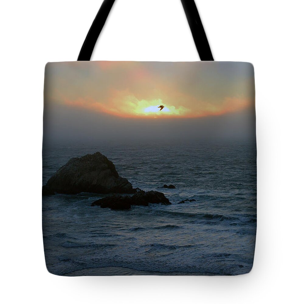 Bird Tote Bag featuring the photograph Sunset with the bird by Dragan Kudjerski