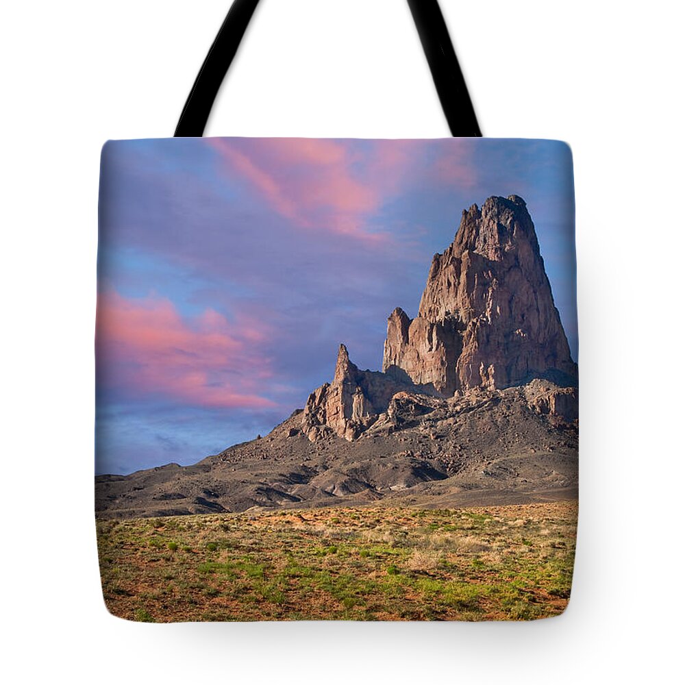 Arid Climate Tote Bag featuring the photograph Sunset on Agathla Peak by Jeff Goulden