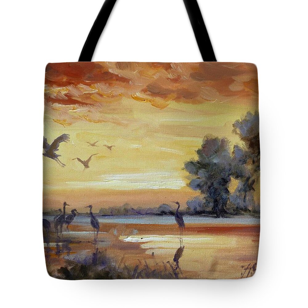 Cranes Tote Bag featuring the painting Sunset on the marshes with cranes by Irek Szelag