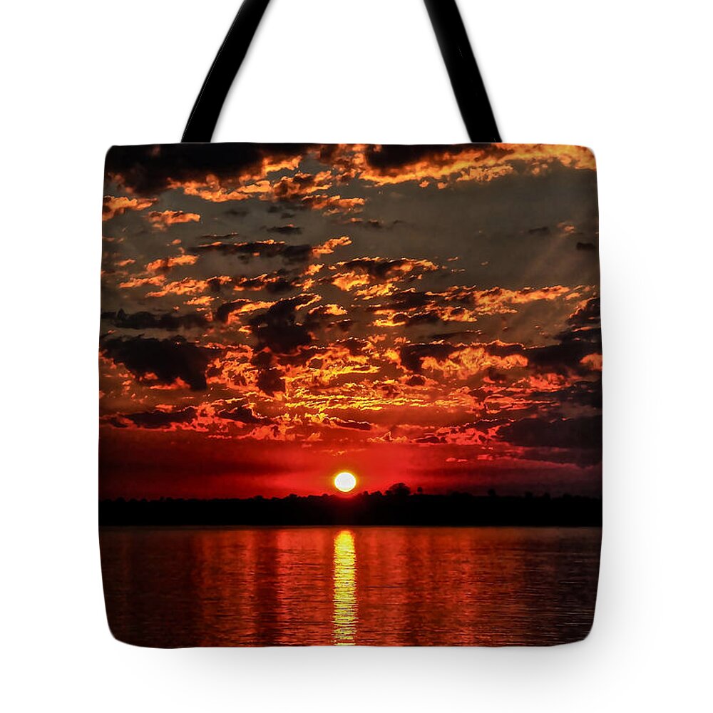 Africa Queen Tote Bag featuring the photograph Sunset on the Zambezi by Don Mercer