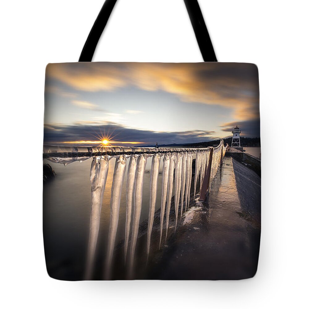 Canada Tote Bag featuring the photograph Sunset over Grand Marais Lighthouse Breakwall by Jakub Sisak